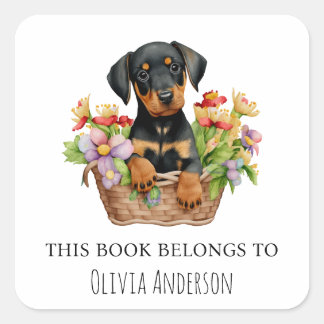 Doberman Puppy in Bloemenmand Dit boek hoort erbij Vierkante Sticker