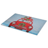 Dobermann in auto met kerstman snijplank (Hoek)