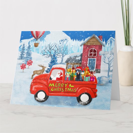 Dobermann in besneeuwde kerstbezorgingswagen kaart (Voorkant)