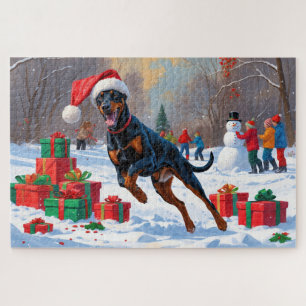 Dobermann loopt in de sneeuw met kerstmuts legpuzzel