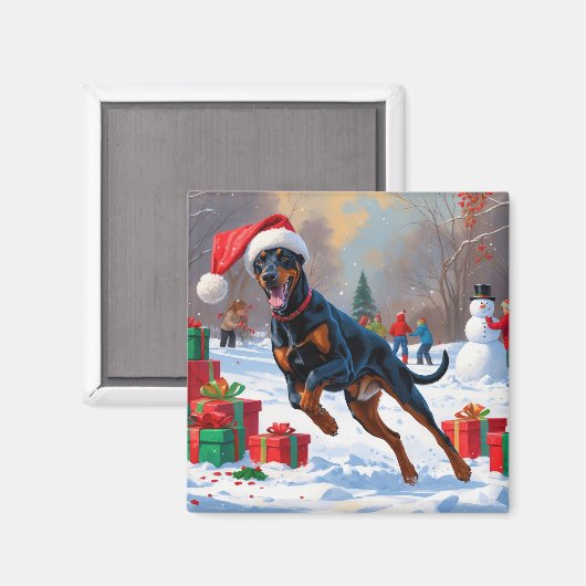 Dobermann loopt in de sneeuw met kerstmuts magneet (Voorkant / Achterkant)