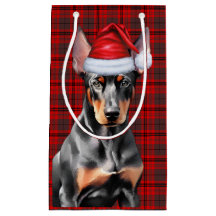 Dobermann Pinscher-hond en rode kerst geruite stof