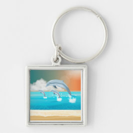 dolfijnen die in de oceaan breken sleutelhanger