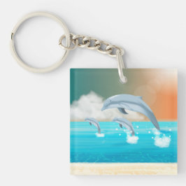 dolfijnen die in de oceaan breken sleutelhanger