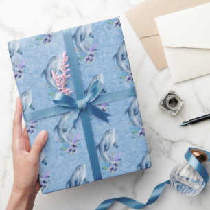 Dolfijnen en bloemen op blauw cadeaupapier
