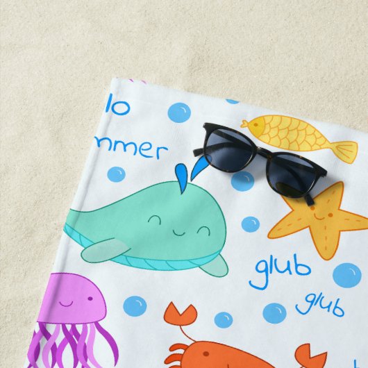 Dolfijnen, krabben, octopus en zeesterren aangepas strandlaken (In situ)