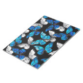 Donker naadloos patroon met blauwe vlinders Morpho Notitieblok (Schuin)