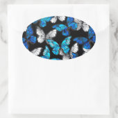 Donker naadloos patroon met blauwe vlinders Morpho Ovale Sticker (Tas)
