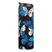Donker naadloos patroon met blauwe vlinders Morpho Thermosbeker (Geroteerd rechts)