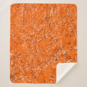 Donkerbruine achtergrond. Zwart wit sinaasappel o Sherpa Deken