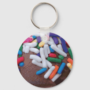 Donkere chocolade-ijs met regenboogspringen sleutelhanger