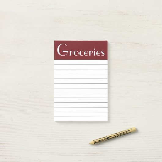 Donkere rode kruidenierswaren die het opmerkt post-it® notes (Op bureau)