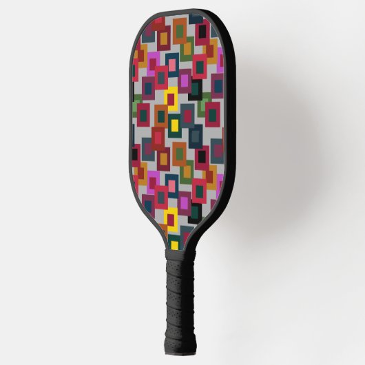 Donkere vierkantjes op licht pickleball paddle (Links)