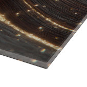 Donkere walnoot houtnerf met sprankelende gouden r snijplank (Hoek)