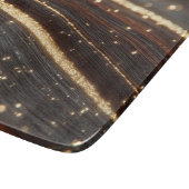 Donkere walnoot houtnerf met sprankelende gouden r snijplank (Hoek)