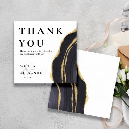 Donkergrijze edelsteen met goud bedankje