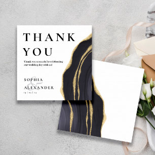 Donkergrijze edelsteen met goud bedankje