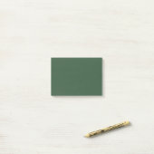 Donkergroene effen kleur post-it® notes (Op bureau)