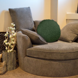 Donkergroene patroonbladeren rond kussen