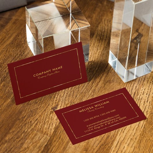 Donkerrode gouden rand en typografie visitekaartje