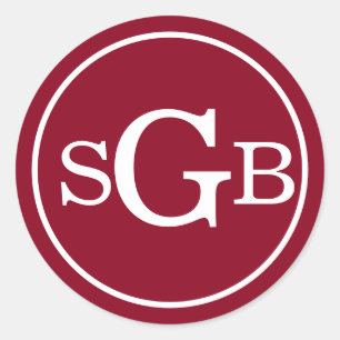 Donkerrood cirkelvormig traditioneel monogram ronde sticker