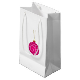 Donkerroze kersttas met kleine cadeautjes klein cadeauzakje