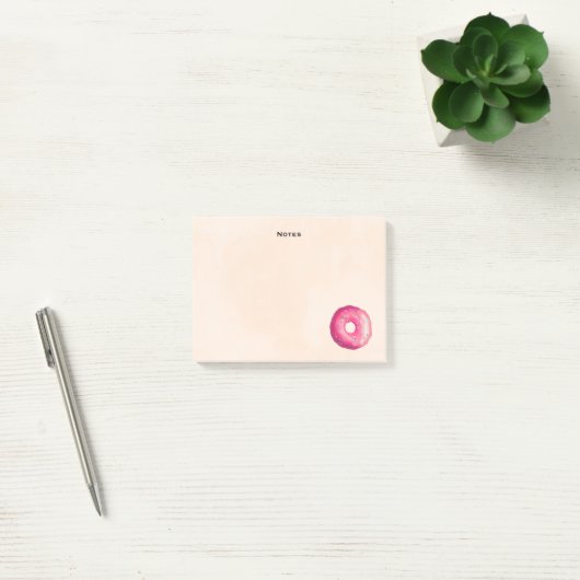 Donut met roze vorst en springen post-it® notes (Kantoor)