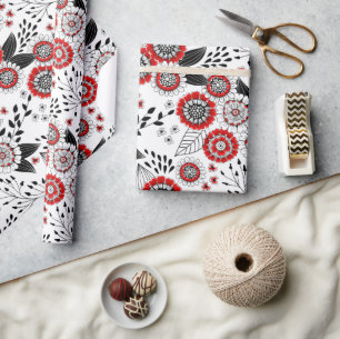 Doodle bloemen en bladeren in rood en zwart cadeaupapier