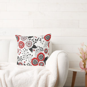 Doodle bloemen en bladeren in rood en zwart kussen