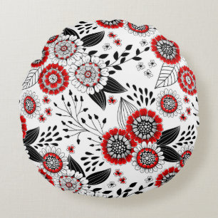 Doodle bloemen en bladeren in rood en zwart rond kussen