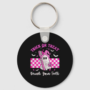 Draag een roze trick-or-treat-tandenborstel tandhe sleutelhanger