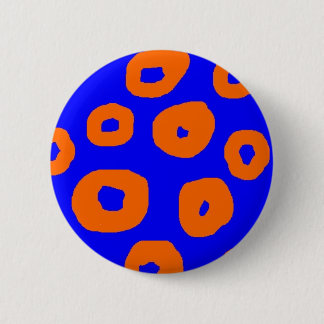 draaiende oranje cirkels op blauwe achtergrondspel ronde button 5,7 cm