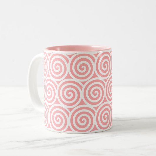 Draaiende spieren op roze en wit tweekleurige koffiemok (Voorkant links)