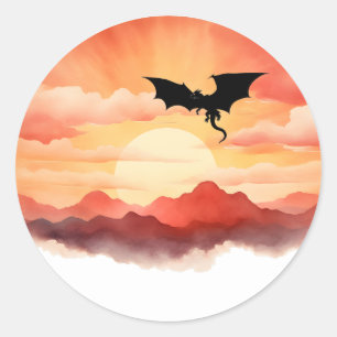 Draak gesilhouet tegen een zonsondergang ronde sticker