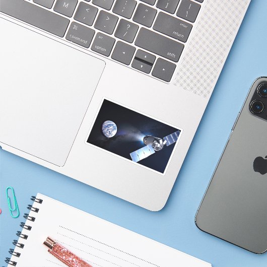 Dragon XL ruimtevaartuig met planeet Aarde op afst Sticker (Laptop met iPhone)