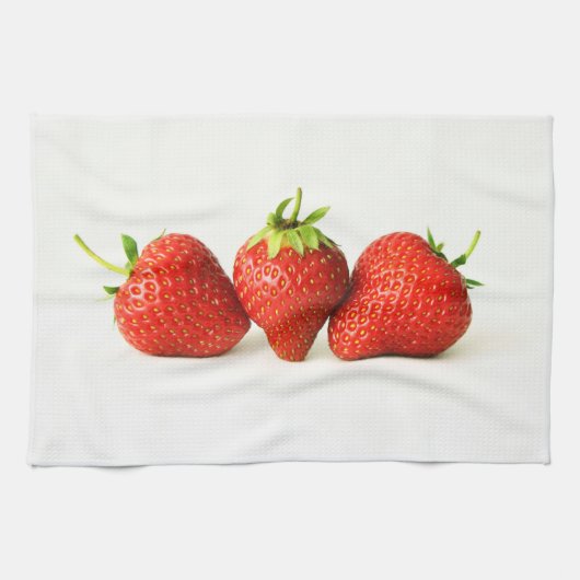 Drie aardbeien op witte kitcna theedoek (Horizontaal)