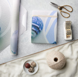 Drie blauw zeeschelpen voor het verpakken van papi cadeaupapier