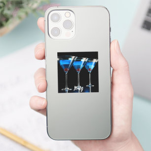 Drie blauwe cocktails met kersen op zwart sticker