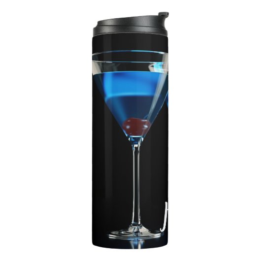 Drie blauwe cocktails met kersen op zwart thermosbeker (Gedraaid links)