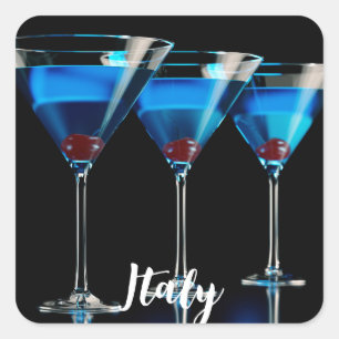 Drie blauwe cocktails met kersen op zwart vierkante sticker