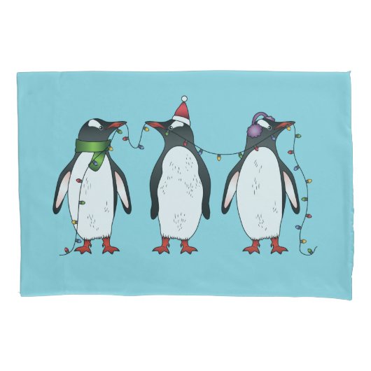 Drie feestelijke kerstpinguïns op lichtblauw kussensloop (Voorkant-Links)