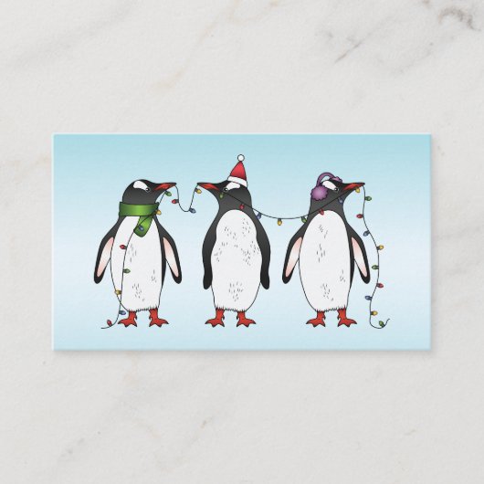 Drie feestelijke kerstpinguïns op lichtblauw visitekaartje (Voorkant)