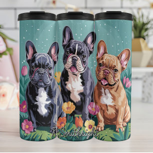 Drie Franse Bulldogs in een tuin Thermosbeker