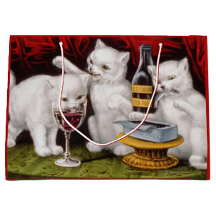 Drie gelukkige kittens op het feest groot cadeauzakje