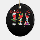 Drie glazen kerstkerstman met rode wijn keramisch ornament (Links)