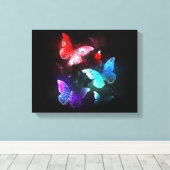 Drie gloeiende vlinders op nachtrustachtergrond canvas afdruk (Insitu (Houten vloer))