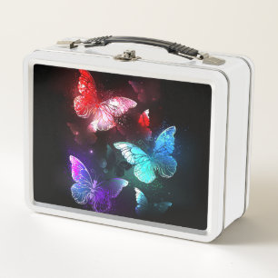 Drie gloeiende vlinders op nachtrustrondergrond