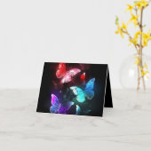 Drie gloeiende vlinders op nachtrustrondergrond kaart (Gele Bloem)