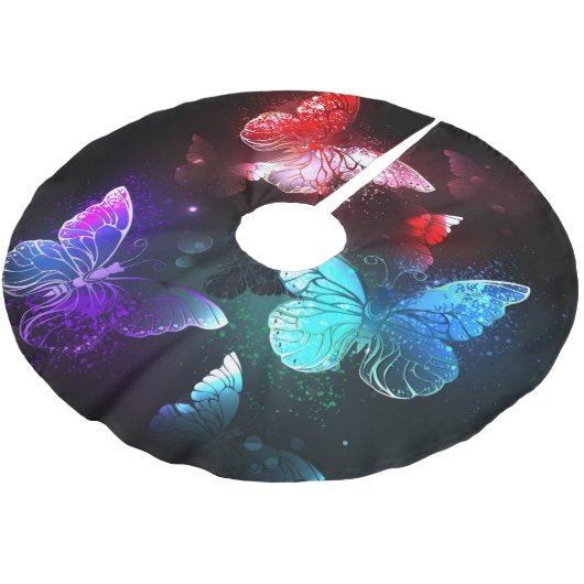 Drie gloeiende vlinders op nachtrustrondergrond kerstboom rok (Gekanteld)