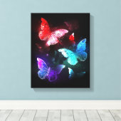 Drie golvende Butterflies op nachtachtergrond Canvas Afdruk (Insitu (Houten vloer))